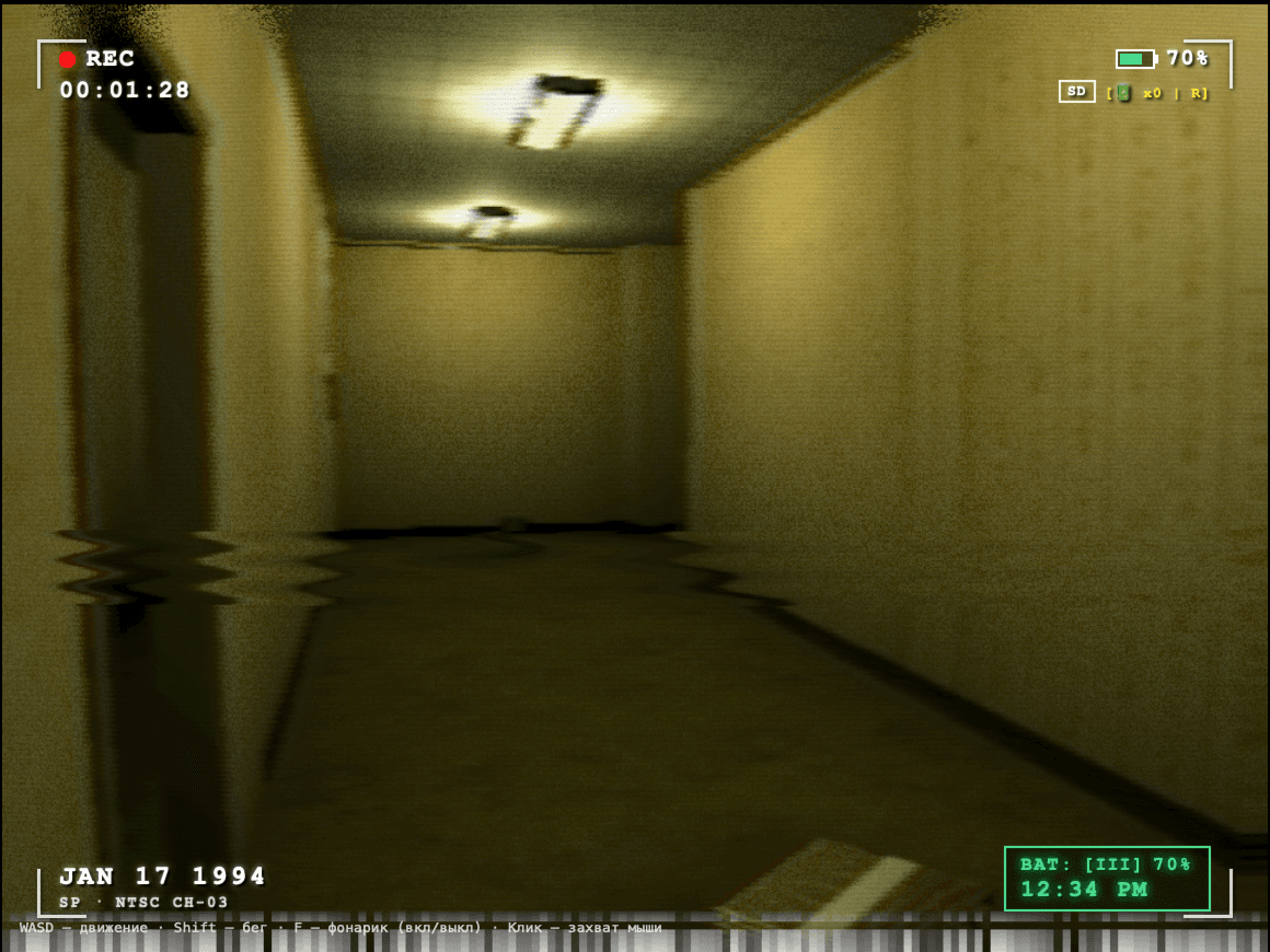First-person VHS camcorder perspective of a mono-yellow Backrooms hallway with overhead fluorescent light fixtures.